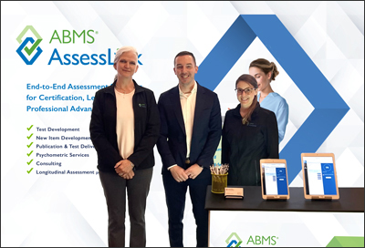ABMS AssessLink team standing in exhibit booth