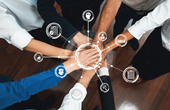 Team hands stacked in huddle