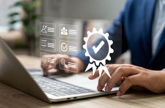 hands typing on a lap top with a graphic overlay